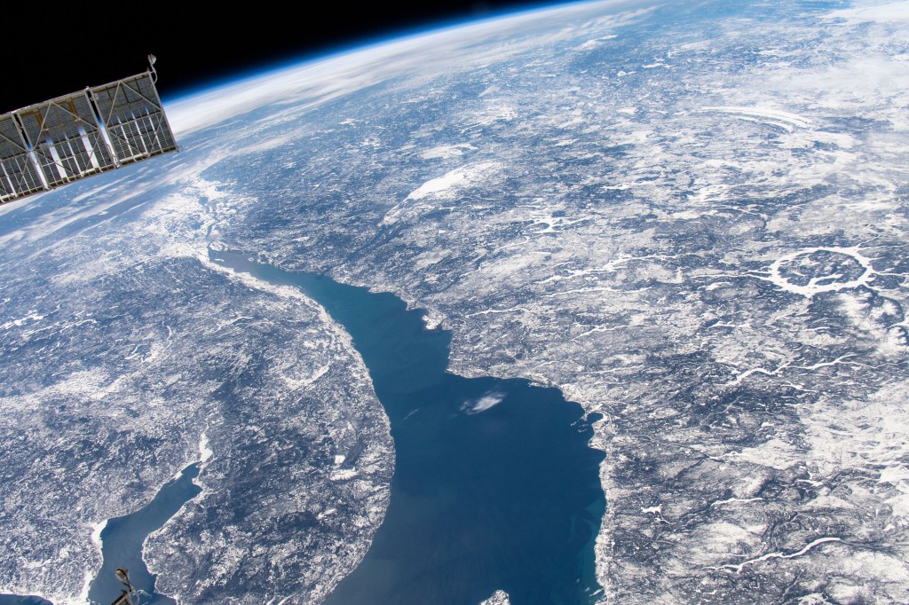 The International Space Station was orbiting 258 miles above Canada when an Expedition 59 crew member photographed Manicouagan Crater (right center) and the St. Lawrence River in Quebec.
