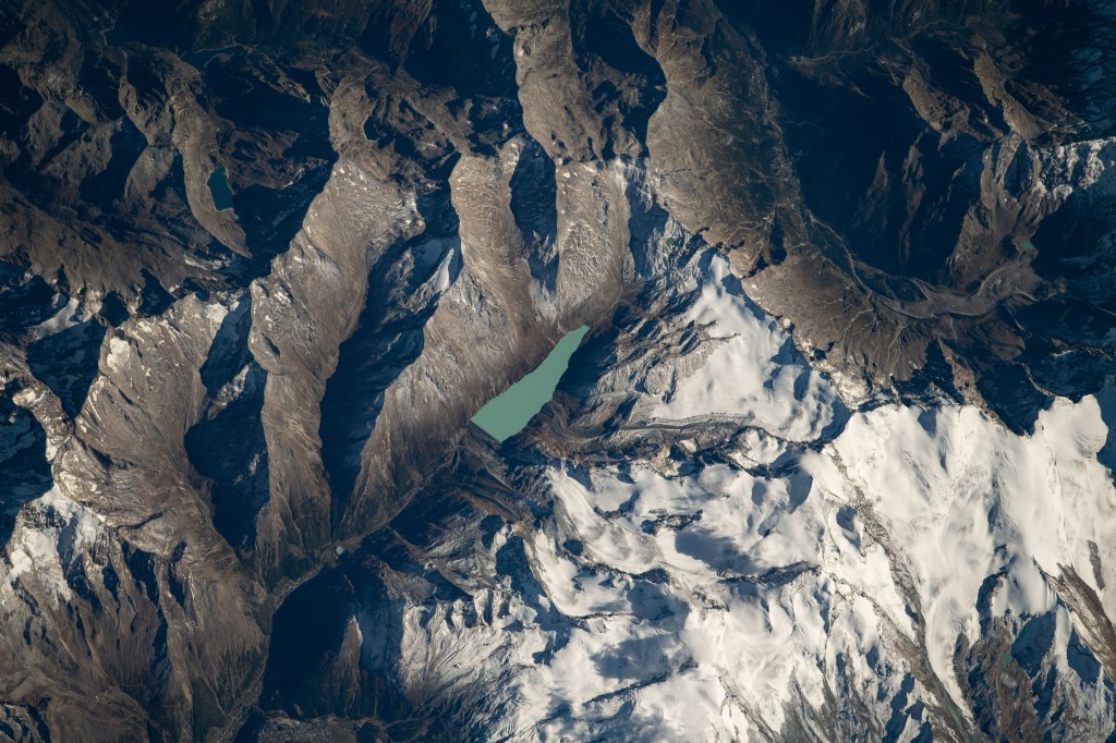 The Mattmarksee, a reservoir built in the early 1960's between the Rimpfischhorn and Stellihorn mountains in the Swiss Alps, was photographed from the International Space Station at an altitude of 253 miles above Switzerland.