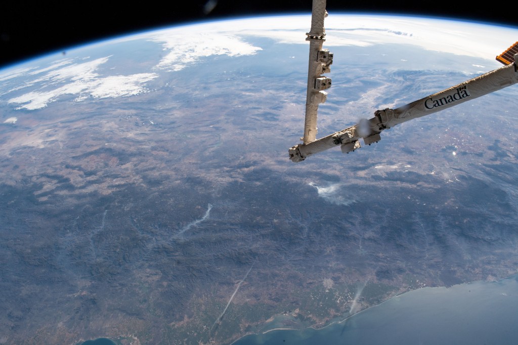 The Mexican state of Sinaloa and its central coast on the Gulf of California are pictured as the International Space Station orbited 255 miles above the Pacific Ocean. The station's Canadarm2 robotic arm is extended in the foreground the day before it would capture and install Northrop Grumman's Cygnus resupply ship to the Unity module.