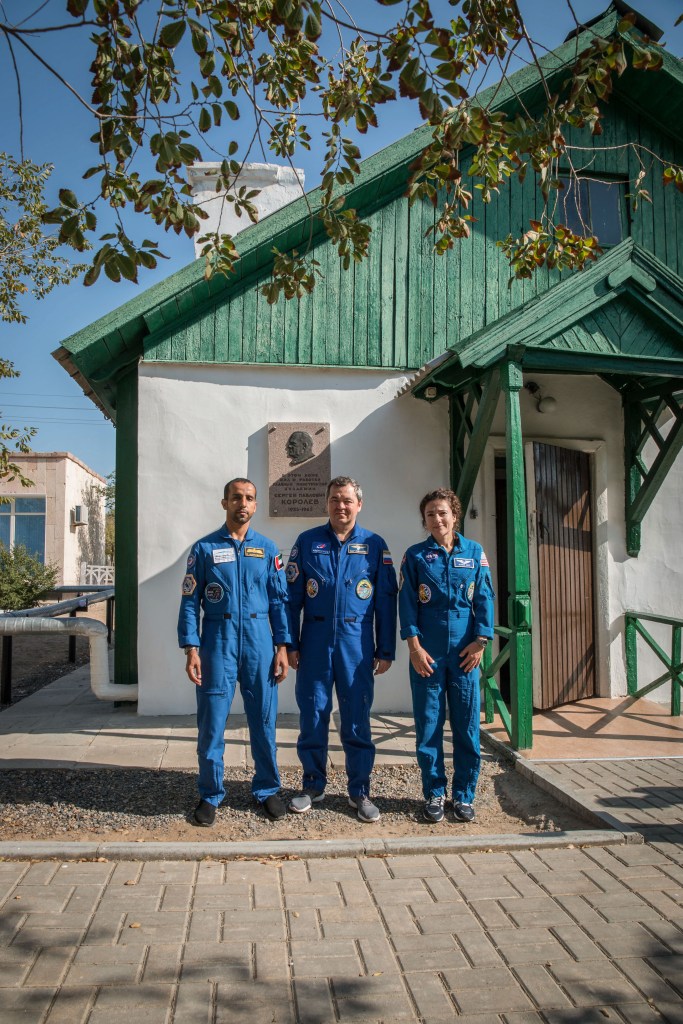 At the Baikonur Cosmodrome in Kazakhstan, the next crew to launch to the International Space Station poses for pictures Sept. 20 in front of the cottage in which the iconic Russian space designer, Sergei Korolev, slept in on the eve of Yuri Gagarin's launch April 12, 1961 to become the first human to fly in space. From left to right are spaceflight participant Hazzaa Ali Almansoori of the United Arab Emirates and Expedition 61 crewmembers Oleg Skripochka of Roscosmos and Jessica Meir of NASA, who will launch Sept. 25 on the Soyuz MS-15 spacecraft for a mission on the International Space Station. Credit: NASA/Victor Zelentsov