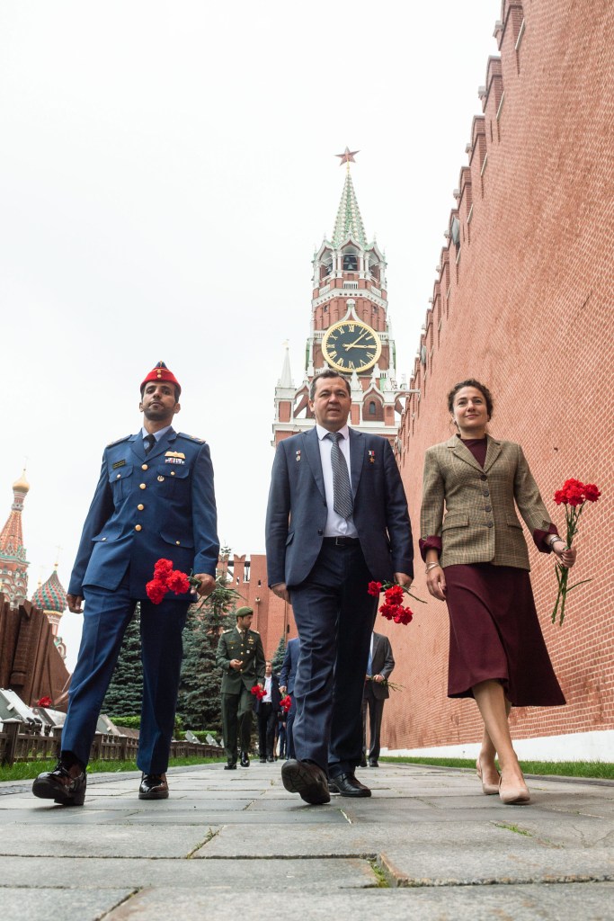 The next crew to launch to the International Space Station walks along the Kremlin Wall at Red Square in Moscow Sept. 5 for the traditional ceremony of laying flowers at the site where Russian space icons are interred. From left to right are spaceflight participant Hazzaa Ali Almansoori of the United Arab Emirates and Expedition 61 crewmembers Oleg Skripochka of Roscosmos and Jessica Meir of NASA. They will launch Sept. 25 from the Baikonur Cosmodrome in Kazakhstan on the Soyuz MS-15 spacecraft for a mission on the International Space Station.