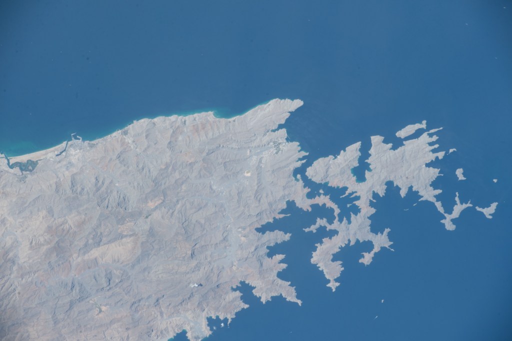 The northern tip of the Middle Eastern nation of Oman is pictured on the Strait of Hormuz. The International Space Station was orbiting above the Persian Gulf when this photograph was taken.