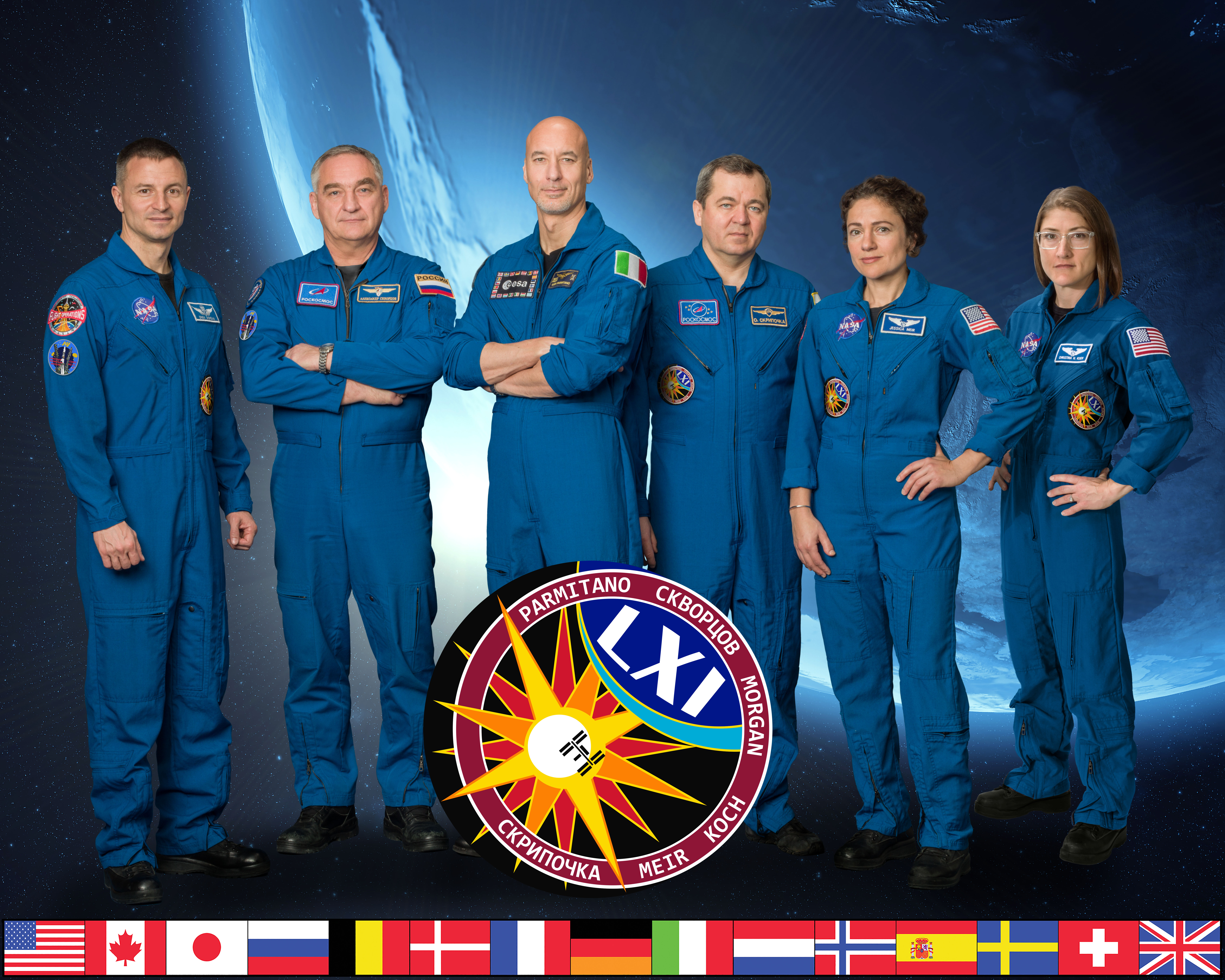The official Expedition 61 crew portrait with (from left) NASA astronaut Andrew Morgan, Roscosmos cosmonaut Alexander Skvortsov, astronaut Luca Parmitano of ESA (European Space Agency), Roscosmos cosmonaut Oleg Skripochka, and NASA astronauts Jessica Meir and Christina Koch.