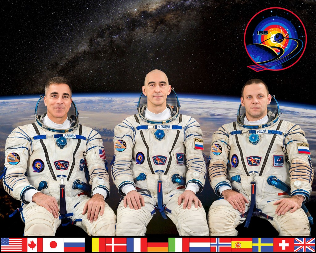 The official Expedition 63 crew portrait. From left are, NASA astronaut and Commander Chris Cassidy and Roscosmos cosmonauts and Flight Engineers Anatoly Ivanishin and Ivan Vagner.