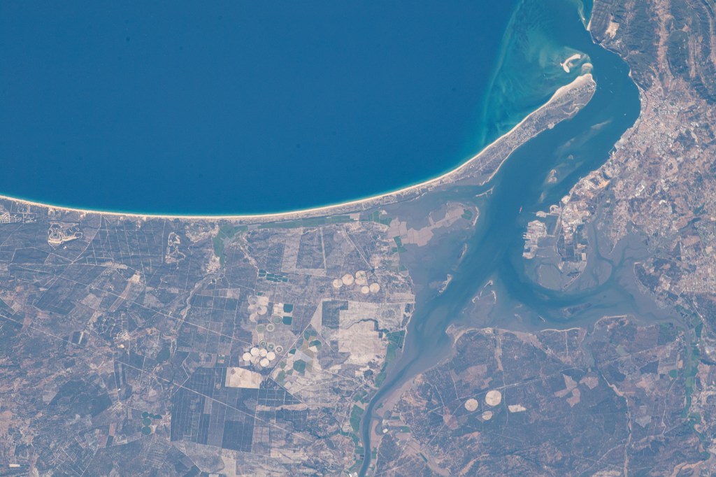 The Portuguese village of Comporta (lower center), pictured from the International Space Station, is on the other side of the Península de Troia from the Sado Estuary Natural Reserve.