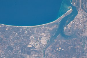 The Portuguese village of Comporta (lower center), pictured from the International Space Station, is on the other side of the Península de Troia from the Sado Estuary Natural Reserve.