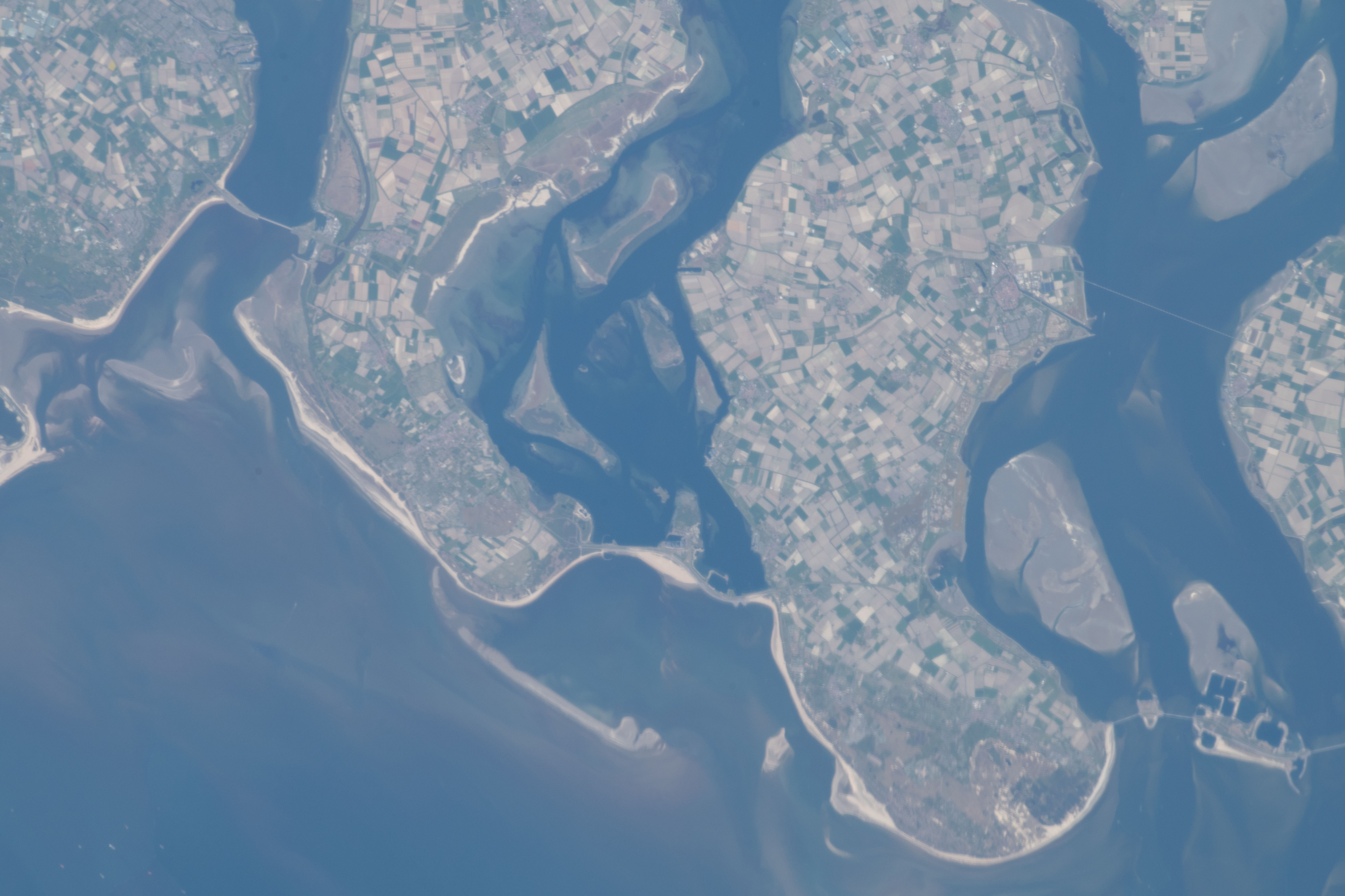 iss063e002730 (April 23, 2020) --- The Rhine–Meuse–Scheldt delta, a river delta in the Netherlands, is pictured from the International Space Station as it orbited off the east coast of England.