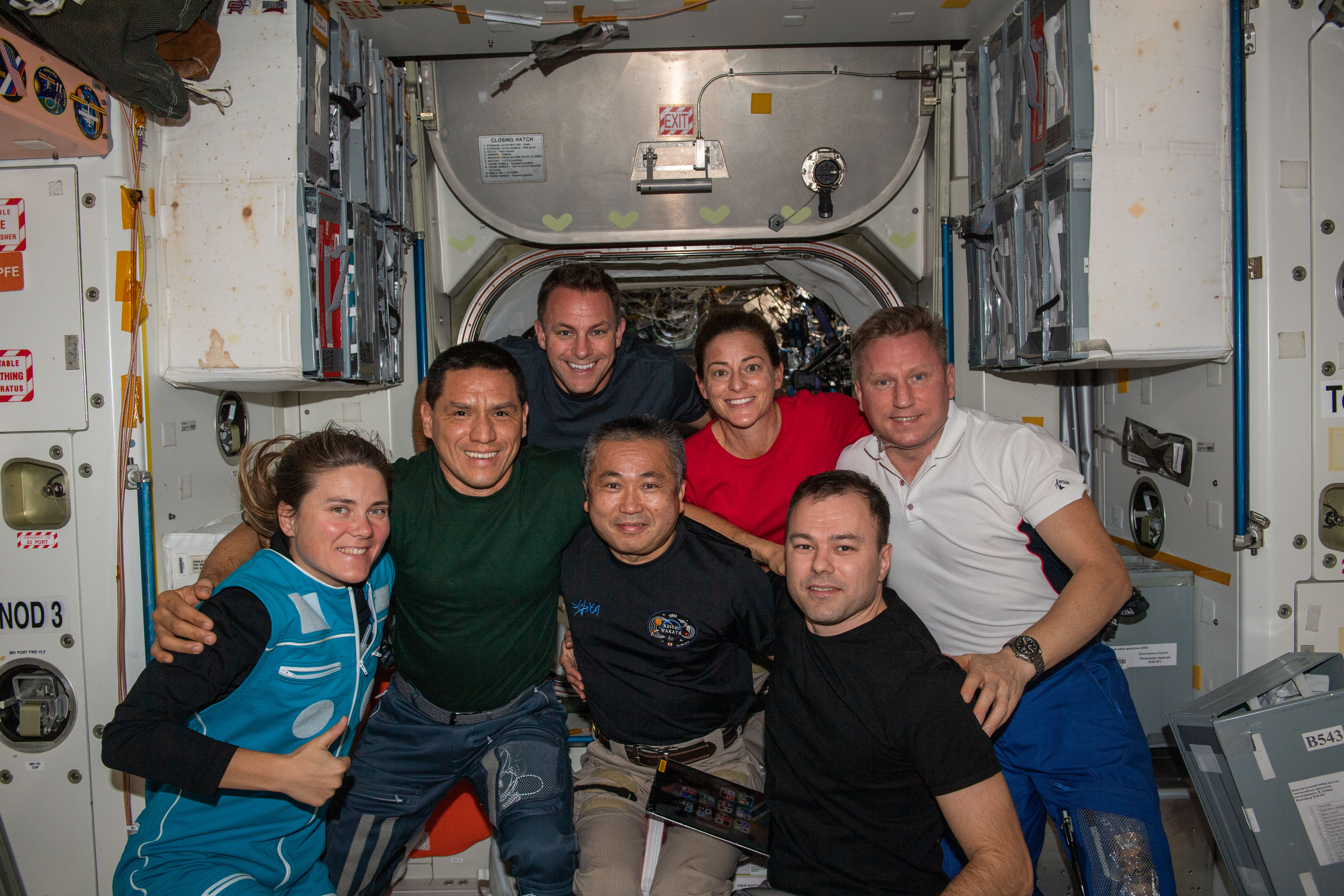 iss068e020546 (Nov. 3, 2022) --- The seven Expedition 68 crew members join each other for a portrait inside the International Space Station's Unity module. From left are, Roscosmos cosmonaut Anna Kikina; NASA astronauts Frank Rubio and Josh Cassada; Japan Aerospace Exploration Agency (JAXA) astronaut Koichi Wakata; NASA astronaut Nicole Mann; and Roscosmos cosmonauts Dmitri Petelin and Sergey Prokopyev.