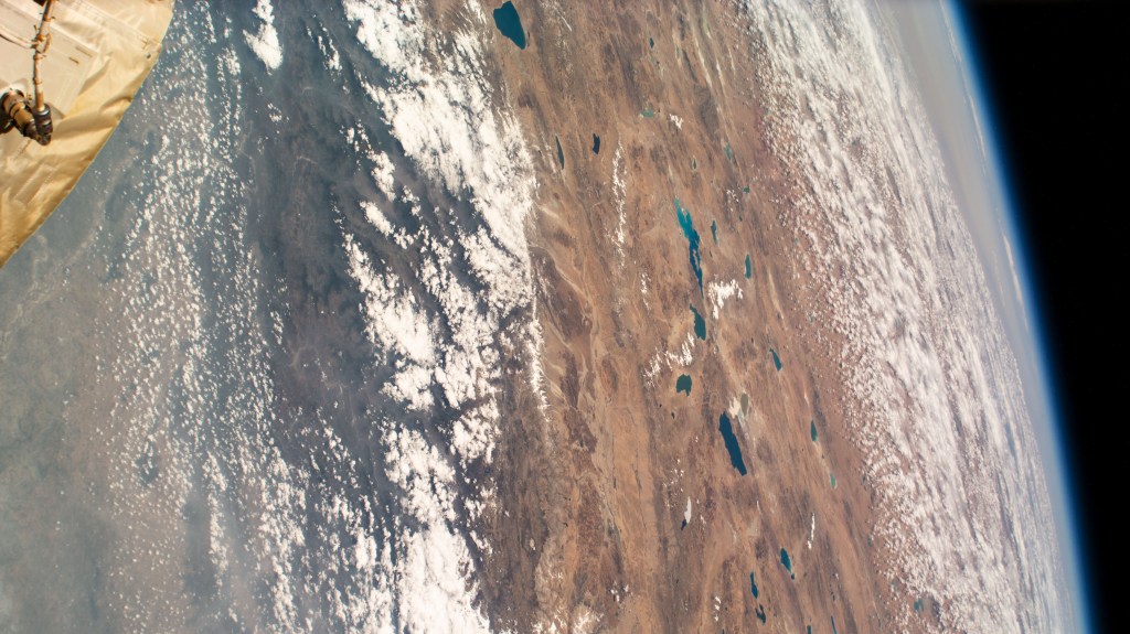 This photograph from the International Space Station looks across the snow-capped Himalayas and into southern China as the orbiting lab flew 262 miles above India.
