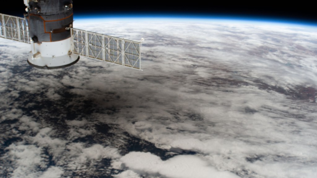 The International Space Station was orbiting above China when this picture of the solar eclipse shadowing a portion of the Asian continent was captured by an external high definition camera. In the left foreground, is the Progress 74 resupply ship from Russia.
