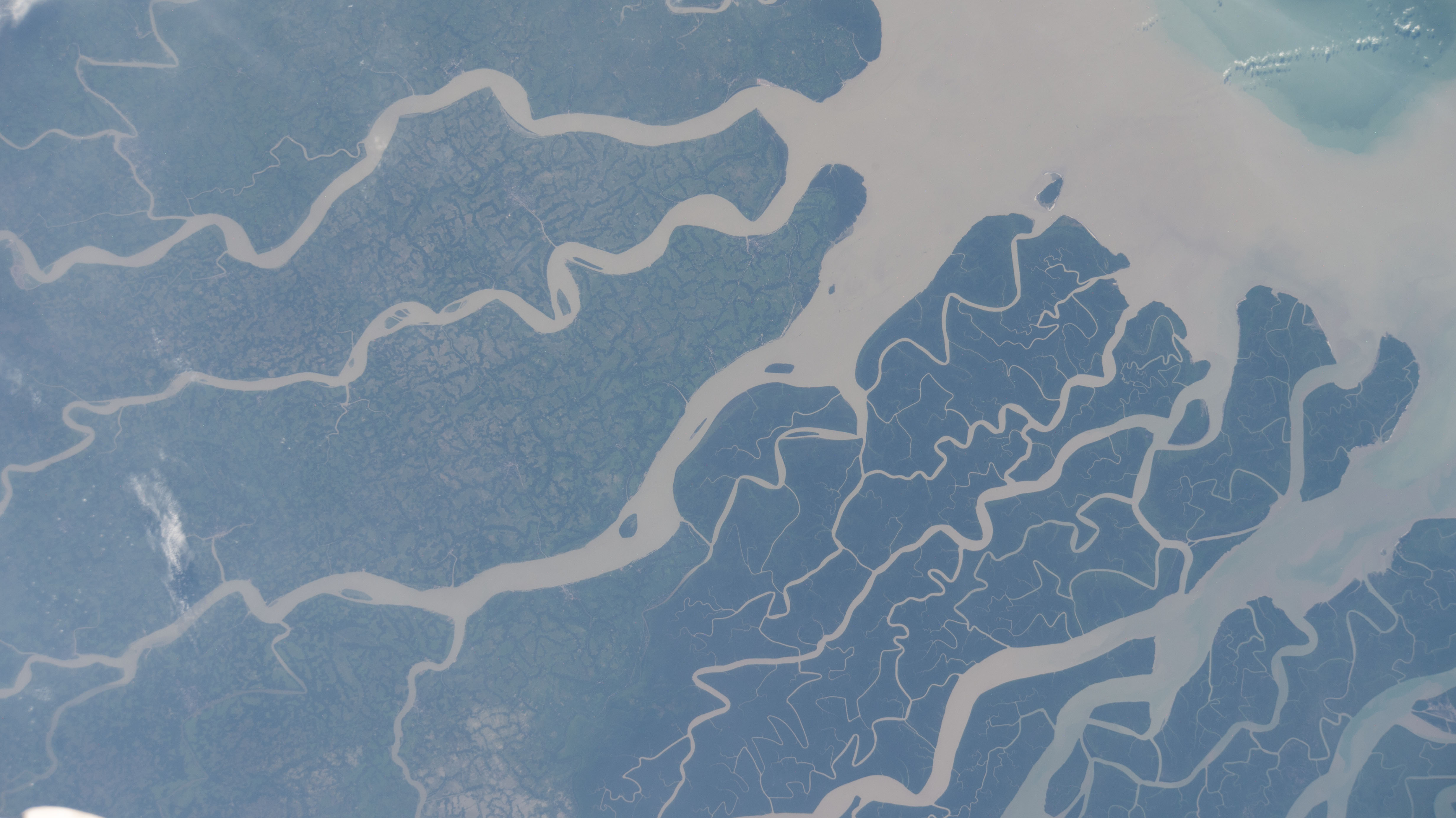 The International Space Station was orbiting above the southern coast of Bangladesh, near the vast mangrove forest and wildlife habitat of India's Sundarban National Park, when this photograph was taken.