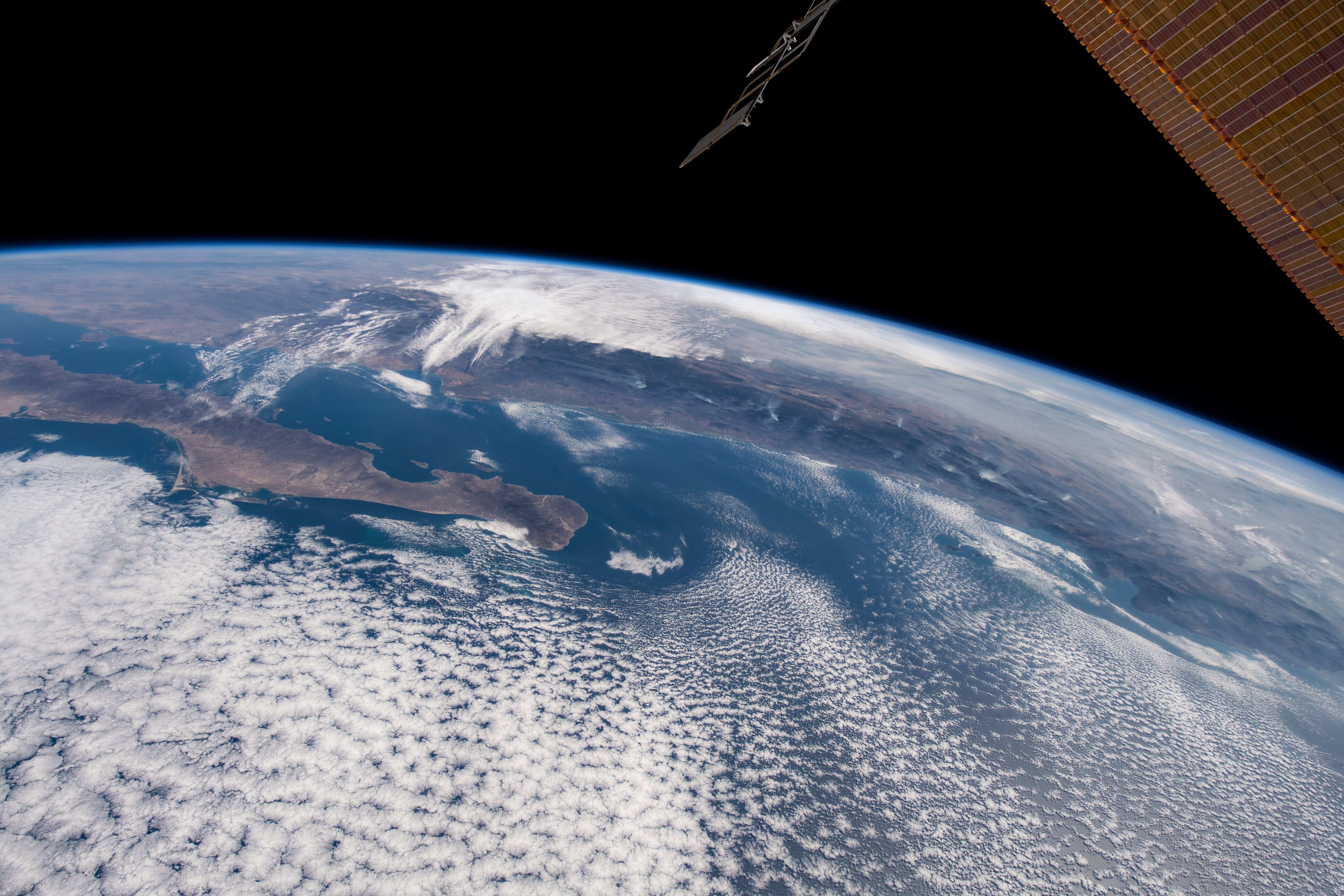 The southern tip of Baja California and the western coast of Mexico are pictured from the International Space Station as it orbited 259 miles above a cloudy Pacific Ocean.