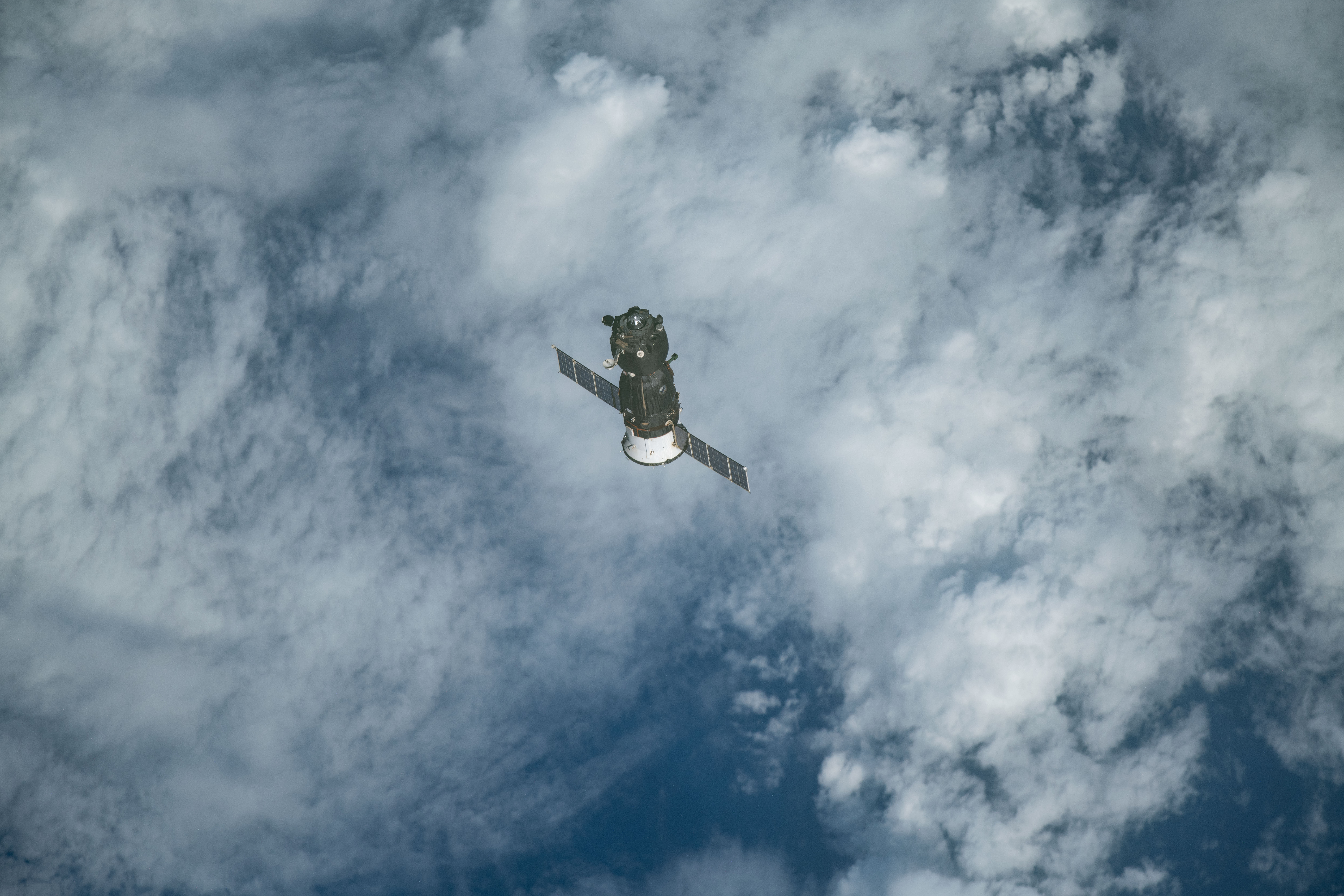 The Soyuz MS-11 crew craft separates from the International Space Station after its undocking and begins its descent to Earth. Expedition 59 crewmembers Oleg Kononenko of Roscosmos, Anne McClain of NASA and David Saint-Jacques of the Canadian Space Agency would parachute to a landing in Kazakhstan aboard the Soyuz after 204 days in space.