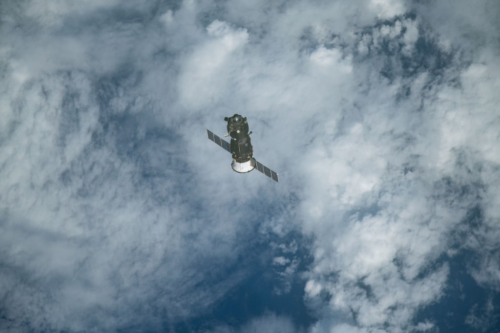 The Soyuz MS-11 crew craft separates from the International Space Station after its undocking and begins its descent to Earth. Expedition 59 crewmembers Oleg Kononenko of Roscosmos, Anne McClain of NASA and David Saint-Jacques of the Canadian Space Agency would parachute to a landing in Kazakhstan aboard the Soyuz after 204 days in space.