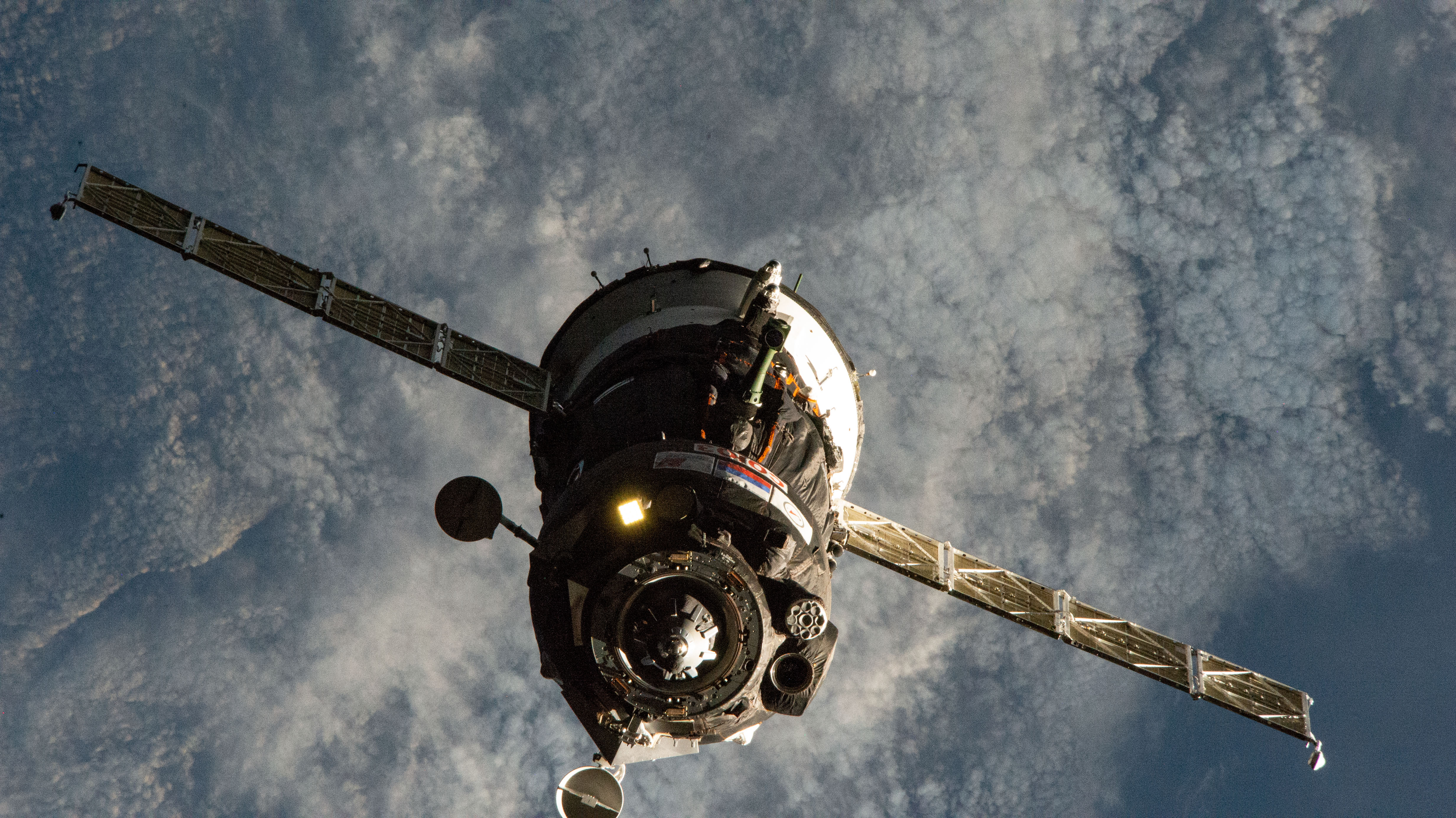 The Soyuz MS-12 spacecraft that launched three new Expedition 59-60 crew members to the International Space Station is pictured approaching its docking port on the Rassvet module. Cosmonaut Alexey Ovchinin from Roscosmos commanded the Soyuz crew ship flanked by NASA astronauts Nick Hague and Christina Koch during the five-hour, 47-minute trip that began at the Baikonur Cosmodrome in Kazakhstan.