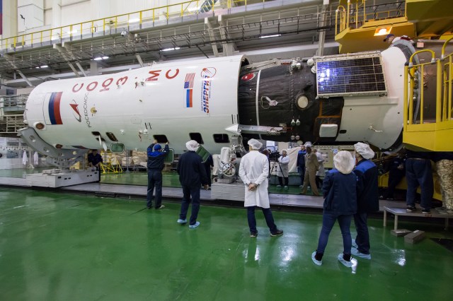 In the Integration Building at the Baikonur Cosmodrome in Kazakhstan, the Soyuz MS-12 spacecraft is encapsulated into the nose fairing of the Soyuz booster rocket March 6. Expedition 59 crew members Nick Hague and Christina Koch of NASA and Alexey Ovchinin of Roscosmos will launch on March 14, U.S. time, on the Soyuz MS-12 spacecraft from the Baikonur Cosmodrome for a six-and-a-half month mission on the International Space Station.