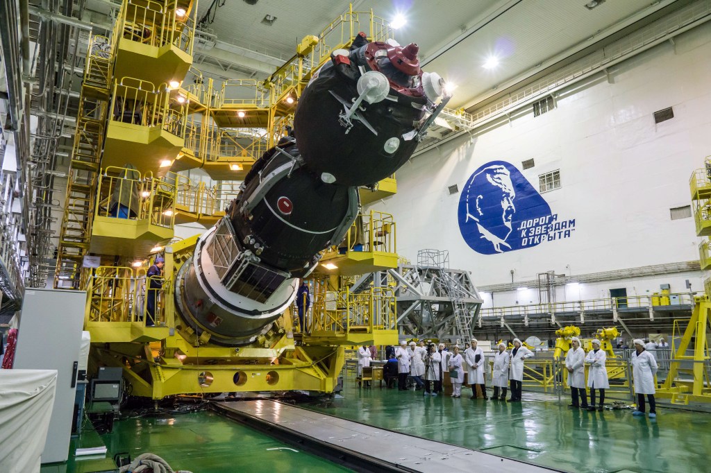 In the Integration Building at the Baikonur Cosmodrome in Kazakhstan, the Soyuz MS-12 spacecraft is lowered into position March 6 prior to its encapsulation into the nose fairing of the Soyuz booster rocket. Expedition 59 crew members Nick Hague and Christina Koch of NASA and Alexey Ovchinin of Roscosmos will launch on March 14, U.S. time, on the Soyuz MS-12 spacecraft from the Baikonur Cosmodrome for a six-and-a-half month mission on the International Space Station.