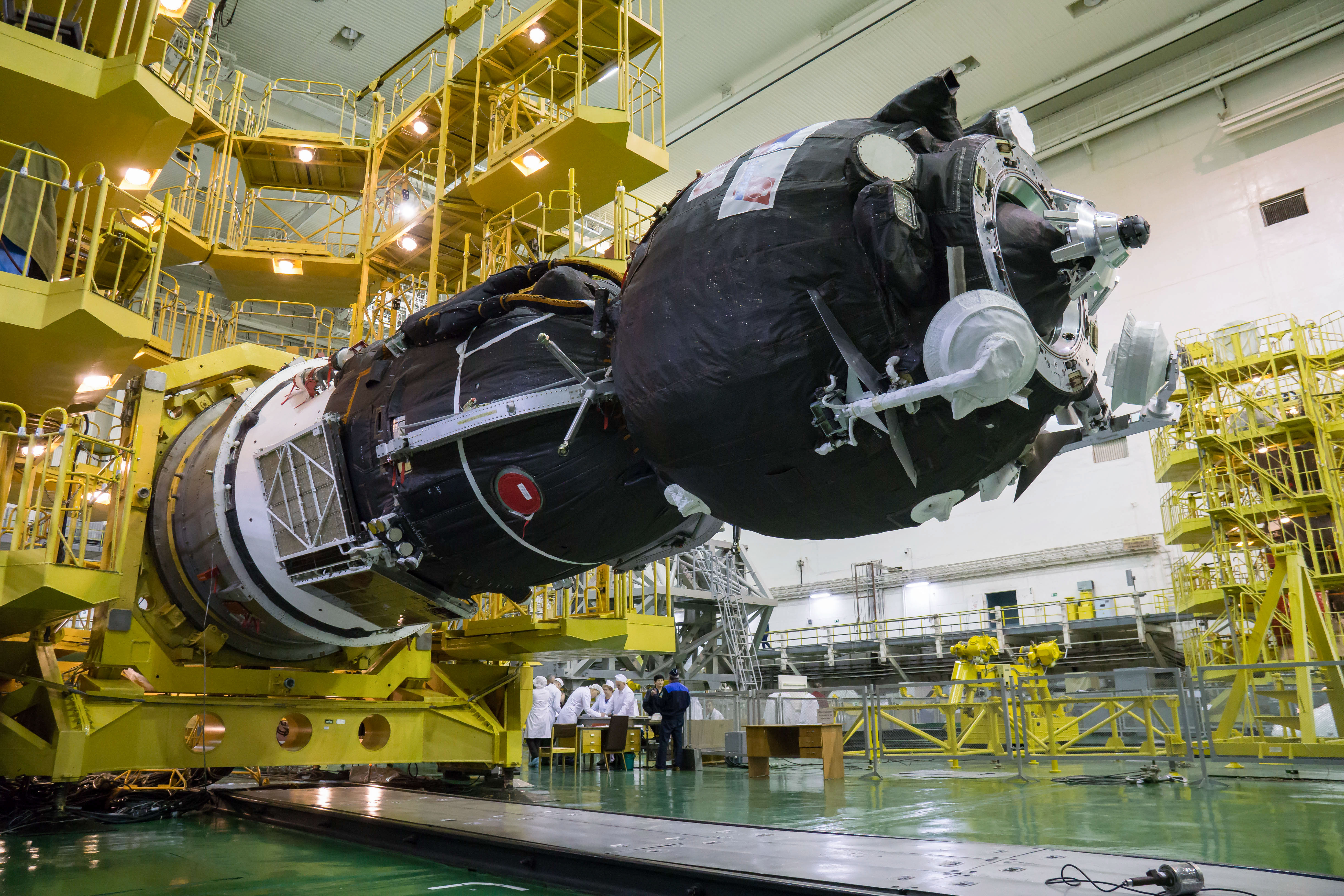 In the Integration Building at the Baikonur Cosmodrome in Kazakhstan, the Soyuz MS-12 spacecraft is lowered into position March 6 prior to its encapsulation into the nose fairing of the Soyuz booster rocket. Expedition 59 crew members Nick Hague and Christina Koch of NASA and Alexey Ovchinin of Roscosmos will launch on March 14, U.S. time, on the Soyuz MS-12 spacecraft from the Baikonur Cosmodrome for a six-and-a-half month mission on the International Space Station.