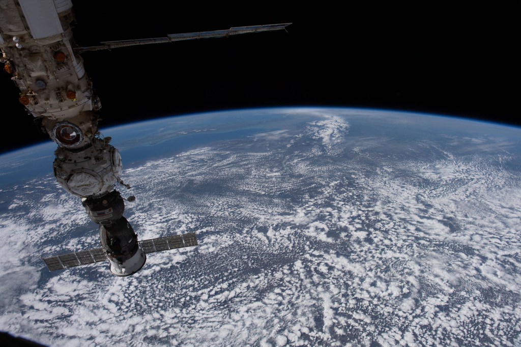 At bottom right, is the Soyuz MS-21 crew ship docked to the Prichal module, which is itself docked to the Nauka multipurpose laboratory module attached to the Russian segment of the International Space Station. The orbiting lab was flying 261 miles above Romania at the time this photograph was taken.