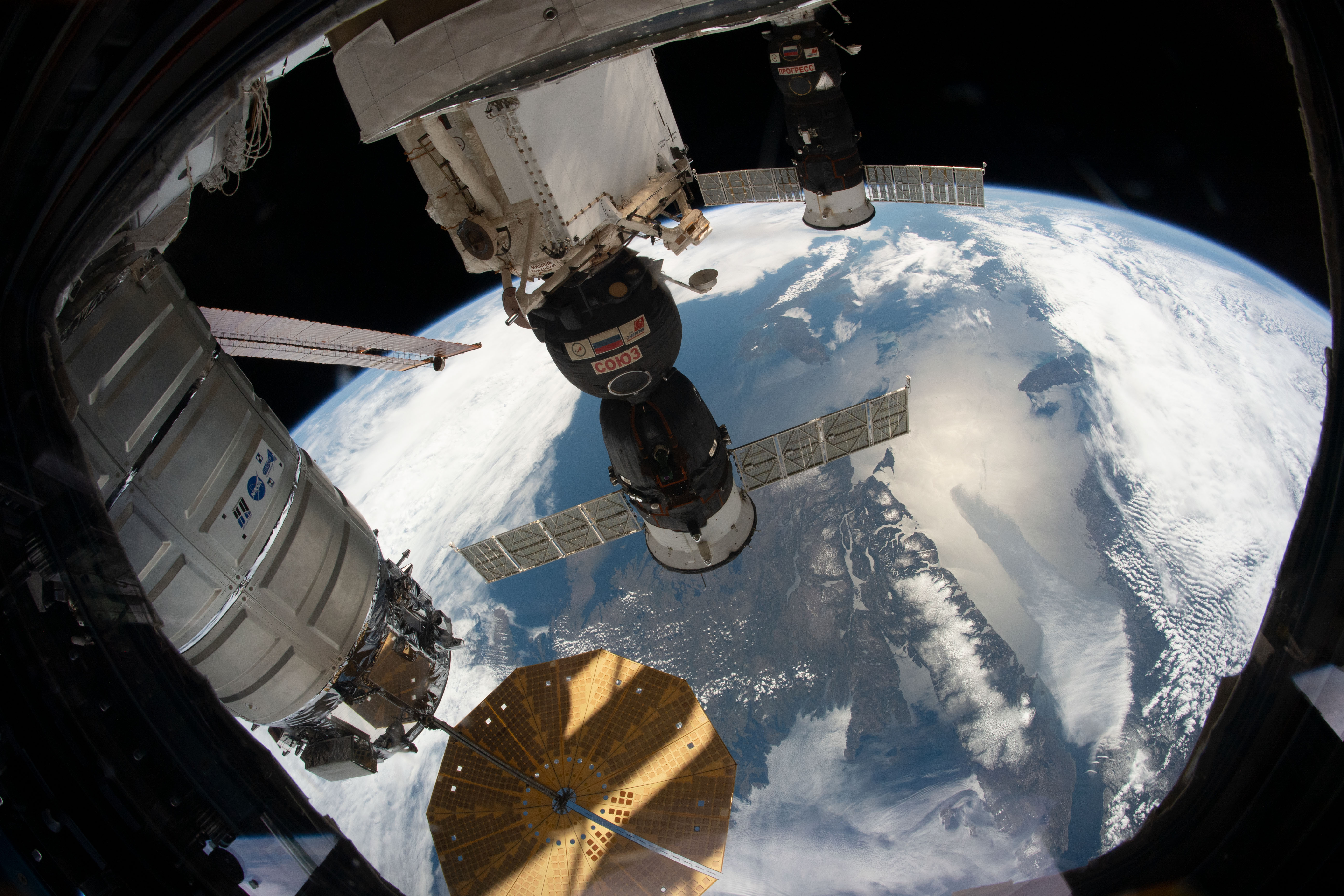 (From bottom to top) The Northrop Grumman Cygnus space freighter, the Soyuz MS-12 crew ship and the Progress 72 cargo craft are pictured attached to the International Space Station as the orbiting complex flew 258 miles above the Gulf of St. Lawrence.