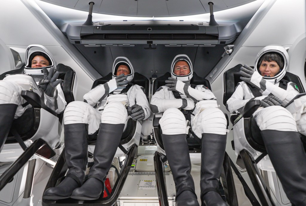 The SpaceX Crew-4 astronauts are seated inside the Dragon Freedom crew ship before their launch atop the Falcon 9 rocket from the Kennedy Space Center in Florida. The commercial crew quartet (from left) are Mission Specialist Jessica Watkins, Pilot Robert Hines, Commander Kjell Lindgren, and Mission Specialist Samantha Cristoforetti. Credit: SpaceX