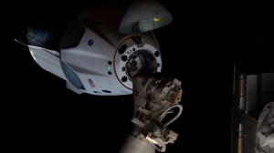 Astronauts Doug Hurley and Bob Behnken of NASA's Commercial Crew Program were aboard the SpaceX Crew Dragon as it approached the International Space Station. The Crew Dragon's nose cone is open revealing the spacecraft's docking mechanism that would connect to the Harmony module's forward International Docking Adapter.
