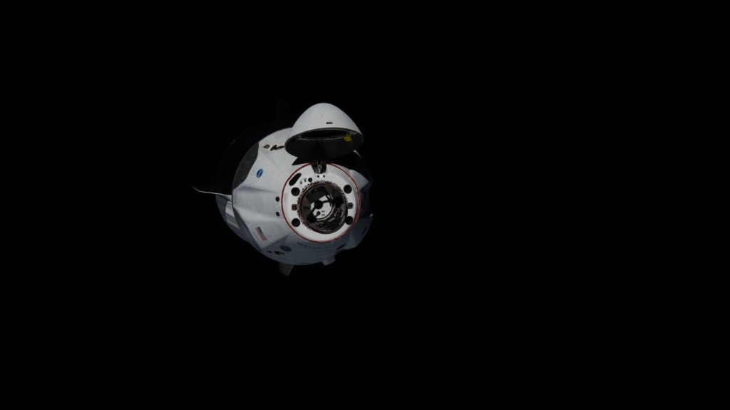 Astronauts Doug Hurley and Bob Behnken of NASA's Commercial Crew Program were aboard the SpaceX Crew Dragon as it approached the International Space Station. The Crew Dragon's nose cone is open revealing the spacecraft's docking mechanism that would connect to the Harmony module's forward International Docking Adapter.