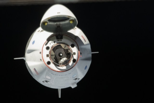 Astronauts Doug Hurley and Bob Behnken of NASA's Commercial Crew Program were aboard the SpaceX Crew Dragon as it approached the International Space Station. The Crew Dragon's nose cone is open revealing the spacecraft's docking mechanism that would connect to the Harmony module's forward International Docking Adapter.
