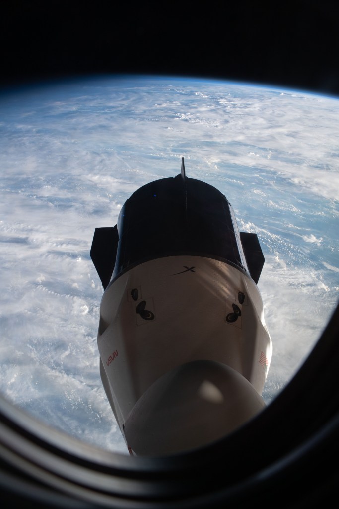 iss068e017228 (Oct. 14, 2022) --- The SpaceX Dragon Endurance crew ship is pictured docked to the forward port of the International Space Station's Harmony module. Endurance was photographed from a window inside the Dragon Freedom crew ship docked to Harmony's space-facing port. Credit: JAXA/Koichi Wakata