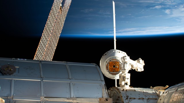 The SpaceX Dragon cargo craft is maneuvered toward the Harmony module's Earth-facing port by robotics controllers remotely operating the Canadarm2 robotic arm. Astronaut David Saint-Jacques earlier commanded the Canadarm2 robotic arm to capture Dragon as astronaut Nick Hague backed him up and monitored systems.