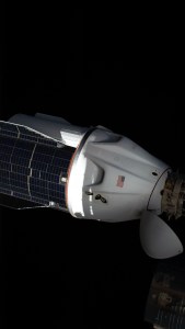 The SpaceX Dragon resupply ship, with its solar panel-covered trunk, is pictured before undocking from the Harmony module's forward port on the International Space Station.