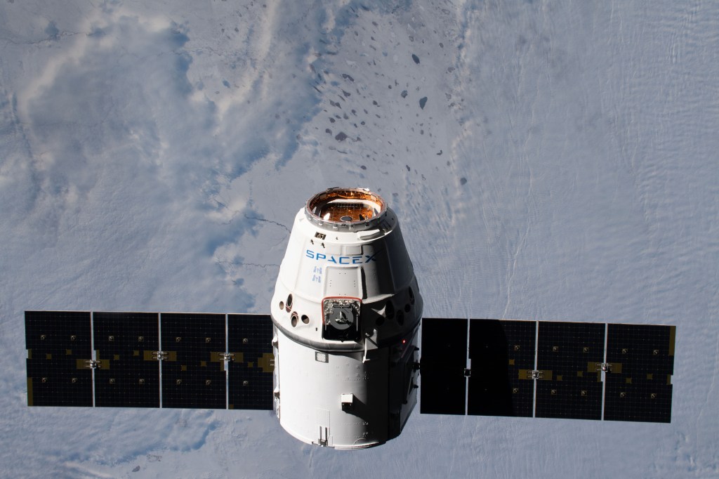 The SpaceX Dragon resupply ship approaches the International Space Station as both spacecraft were orbiting 261 miles above Kazakhstan.