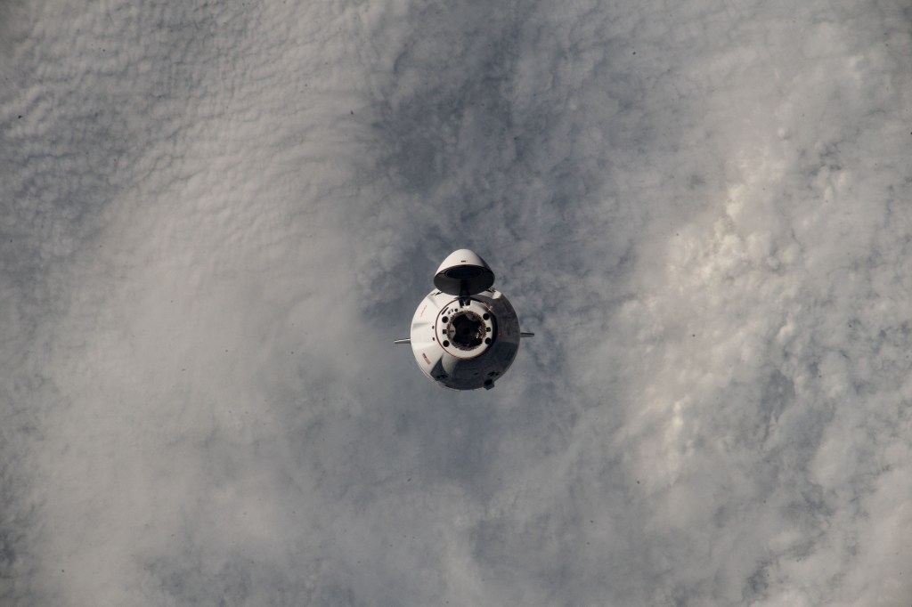 iss068e075526 (March 16, 2023) --- The SpaceX Dragon resupply ship approaches the International Space Station carrying more than 6,200 pounds of science experiments, crew supplies, and other cargo, to replenish the Expedition 68 crew. Both spacecraft were flying 273 miles above the southern Atlantic Ocean at the time of this photograph.