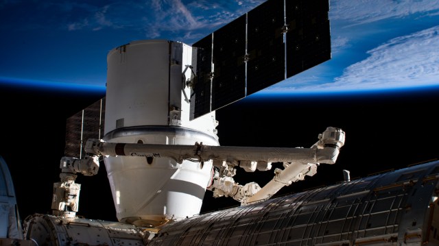The SpaceX Dragon resupply ship is pictured berthed to the Harmony module as the International Space Station orbited 258 miles above east Asia. Dragon was still in the grips of the Canadarm2 robotic arm shortly after it was installed on Harmony.