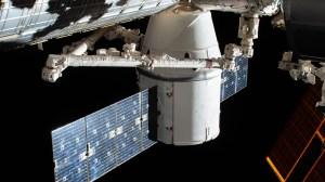 The SpaceX Dragon resupply ship is pictured in the grip of the Canadarm2 robotic arm after it was installed to the Harmony module. The International Space Station was orbiting 262 miles above the North Pacific Ocean when this photograph was taken by an external high definition camera.
