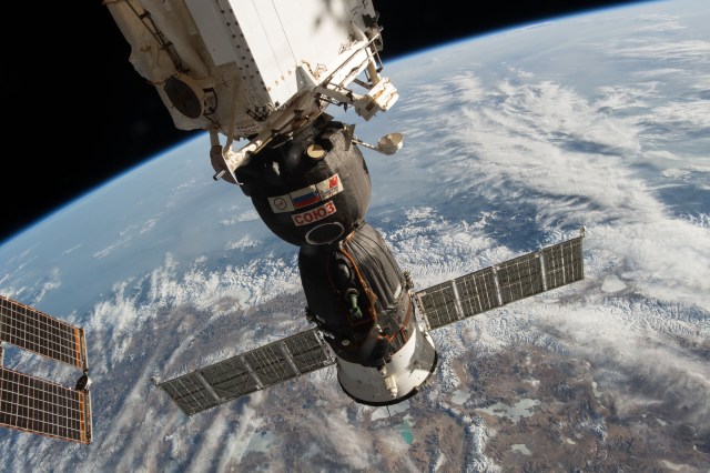 The Soyuz MS-12 crew ship is pictured docked to the Rassvet module as the International Space Station orbited 256 miles above India, Nepal and China.