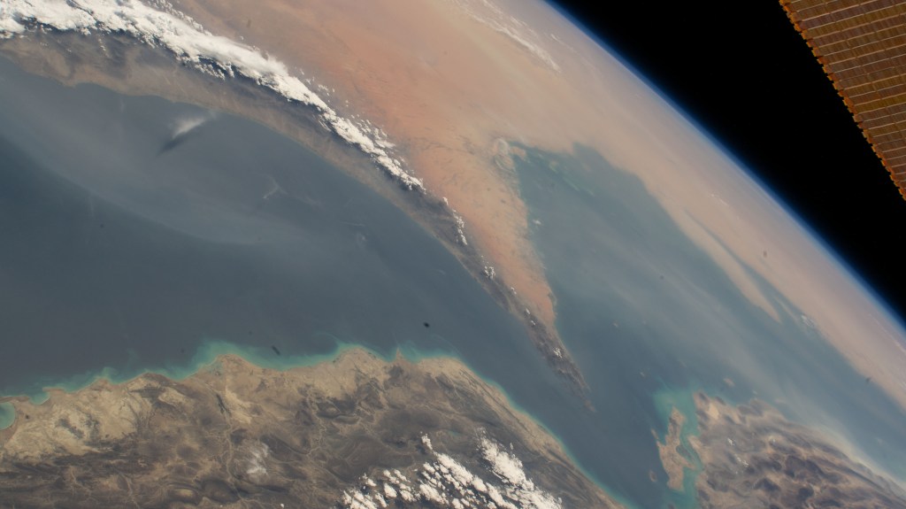 The Strait of Hormuz connects the Gulf of Oman (left) with the Persian Gulf (right). The waterway also separates the Middle Eastern nation of Iran (bottom) from the Arabian Peninsula nations of Oman, United Arab Emirates, and Qatar (top left to right).