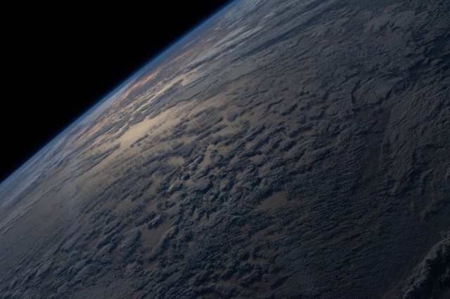 The sun's glint beams off a partly cloudy, southern Atlantic Ocean is this photograph from the International Space Station as it orbited 272 miles above the Earth.