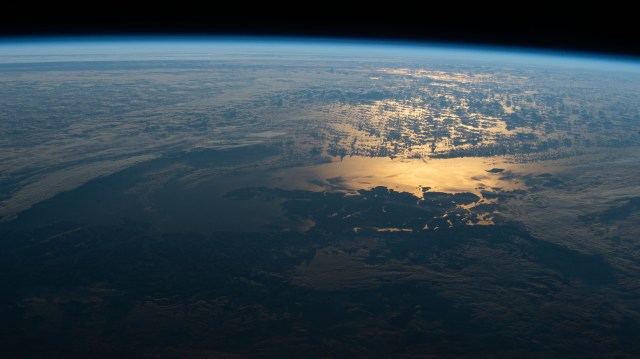 The sun's glint beams off the South Pacific coast of southern Chile's Laguna San Rafael National Park. This picture was taken from the International Space Station as it orbited in the South Atlantic Ocean off the coast of Argentina.