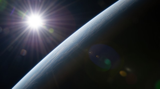 The sun's rays burst above Earth's horizon as the International Space Station orbited 264 miles above Western Australia on the coast of Shark Bay.
