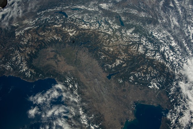 The Swiss Alps surround Northern Italy's Po Valley region in this photograph taken from the International Space Station as it orbited 259 miles above.