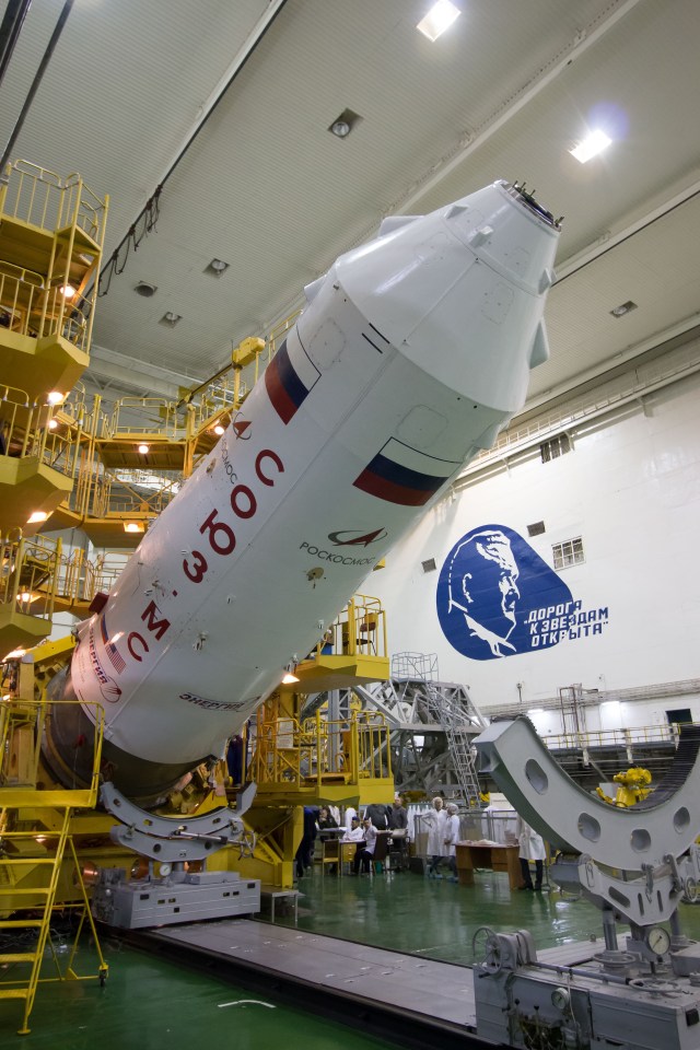 In the Integration Building at the Baikonur Cosmodrome in Kazakhstan, the upper stage of the Soyuz booster rocket is rotated back to a vertical position March 6 after the Soyuz MS-12 spacecraft was encapsulated into the booster’s nose fairing. Expedition 59 crew members Nick Hague and Christina Koch of NASA and Alexey Ovchinin of Roscosmos will launch on March 14, U.S. time, on the Soyuz MS-12 spacecraft from the Baikonur Cosmodrome for a six-and-a-half month mission on the International Space Station.