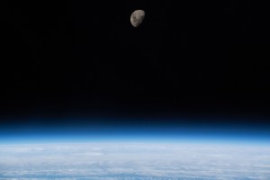 The waxing gibbous moon is pictured above Earth's limb as the International Space Station was orbiting 266 miles above the South Atlantic Ocean.