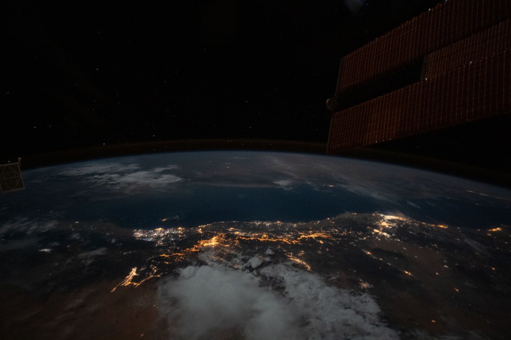 The well lit Red Sea coast of Saudi Arabia is pictured from the International Space Station during an orbital night pass.