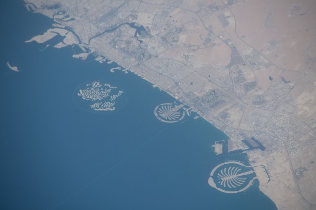 The artificial islands off the coast of Dubai in the United Arab Emirates are known as (from left) The World Islands, Palm Jumeirah and Palm Jebel Ali. The International Space Station was orbiting 255 miles above Saudi Arabia about to cross the Persian Gulf when this photograph was taken by an Expedition 59 crew member.