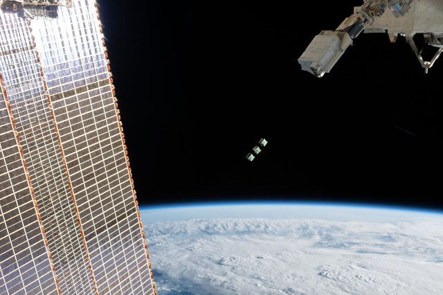 A set of three CubeSats are ejected from the Japanese Small Satellite Orbital Deployer attached to a robotic arm outside of the Japan Aerospace Exploration Agency's Kibo laboratory module. The tiny satellites from Nepal, Sri Lanka and Japan were released into Earth orbit for technology demonstrations. The International Space Station was orbiting 256 miles above the Amazon River in Brazil when an Expedition 59 crewmember took this photograph.