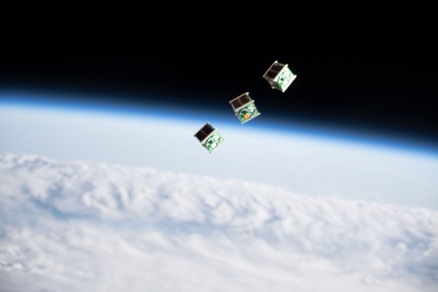 A set of three CubeSats are pictured shortly after being ejected from the Japanese Small Satellite Orbital Deployer attached to a robotic arm outside of the Japan Aerospace Exploration Agency's Kibo laboratory module. The tiny satellites from Nepal, Sri Lanka and Japan were released into Earth orbit for technology demonstrations.