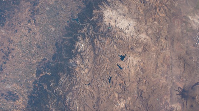 iss068e043794 (Jan. 28, 2023) --- Tiny lakes, in the Andes mountain range on the border between Argentina and Chile, are pictured from the International Space Station as it orbited 264 miles above the South American continent near the Pacific coast.