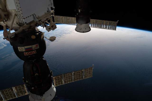 Two docked Russian spaceships, including the Soyuz MS-12 crew craft and the Progress 72 space freighter, are highlighted in this image as the International Space Station was about to cross South America 263 miles above the Atlantic Ocean.