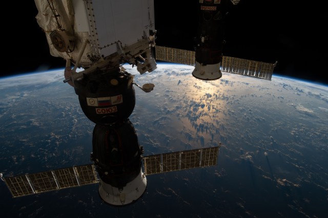 Two docked Russian spaceships, the Soyuz MS-12 crew ship (foreground) and the Progress 72 resupply ship, are pictured as the International Space Station orbited 258 miles above the Atlantic Ocean northeast of Puerto Rico.